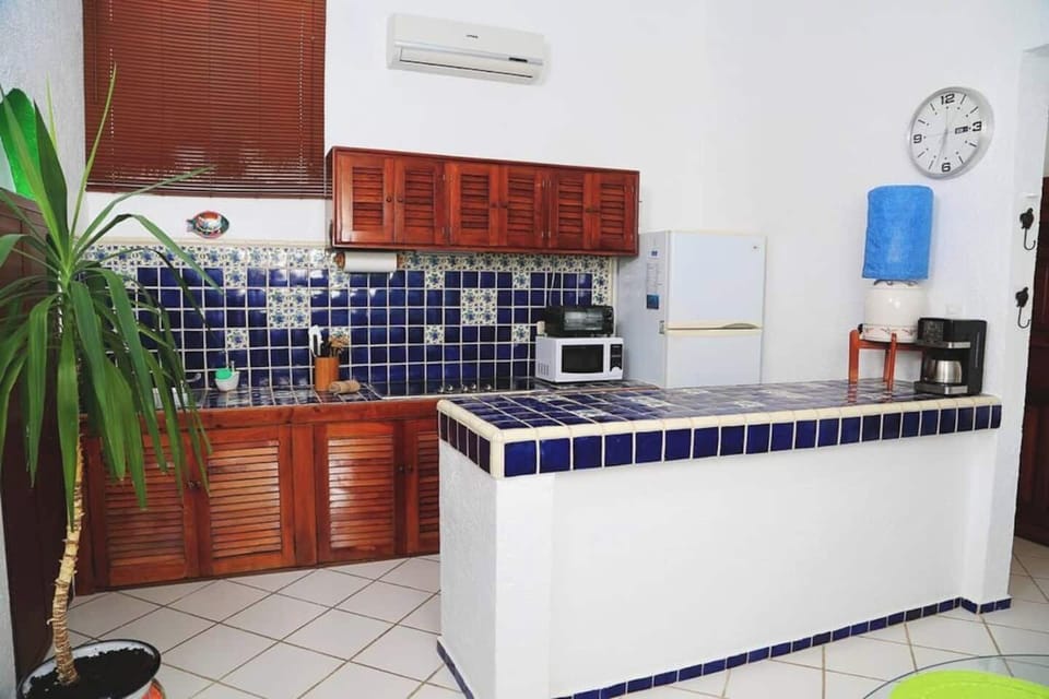 Fully equipped kitchen and breakfast bar in Yal Ku Cai 1E