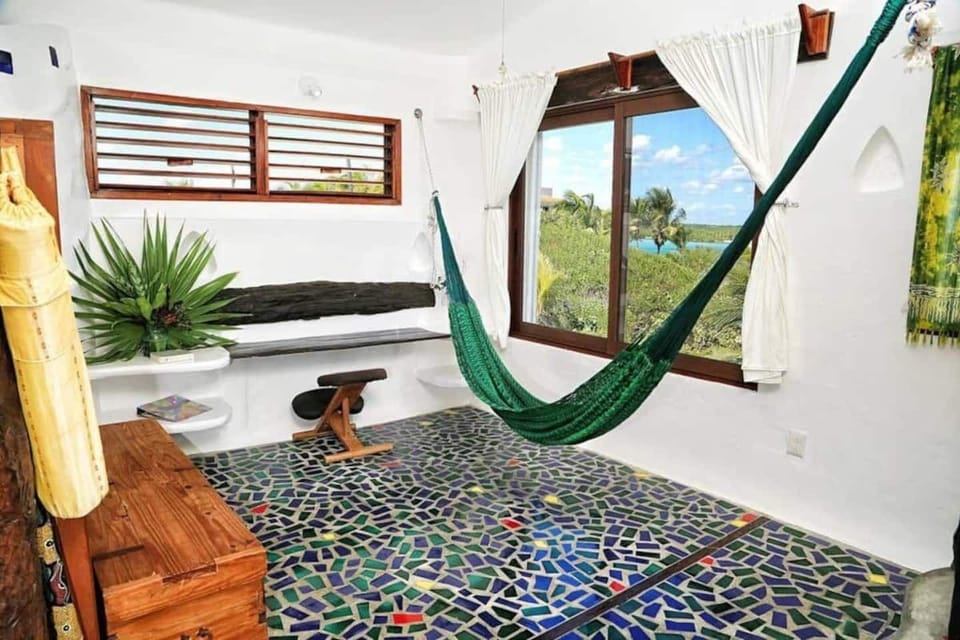A flex space 3 steps up from the kitchen and living area- for an office or yoga!