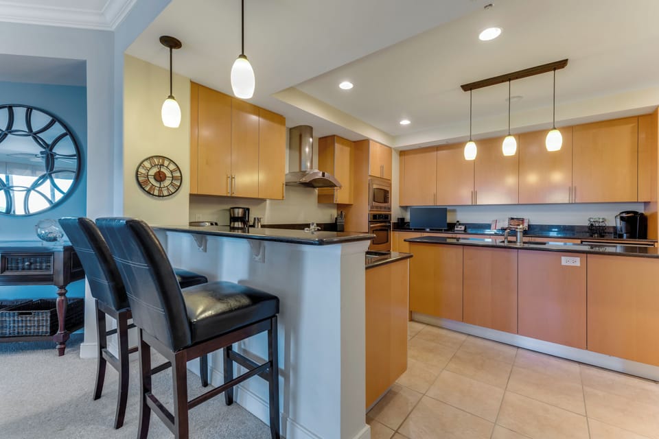 Breakfast bar facing large "fully equipped" gourmet kitchen 