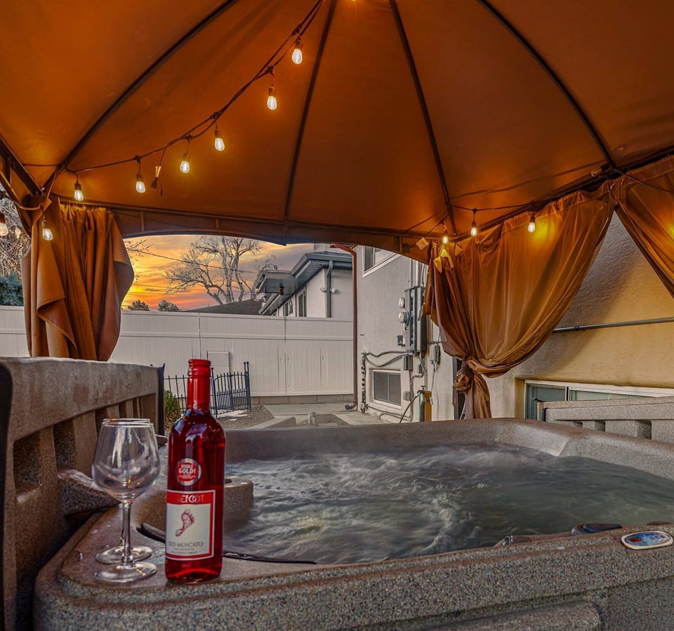 Relax by the hot tub while you watch the sunset over the mountains.