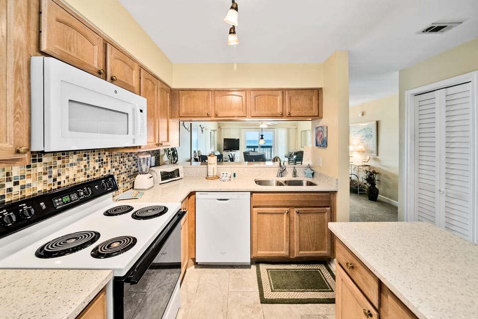 Your fully-equipped kitchen features warm wood cabinets, granite counters, and everything you need to create memorable vacation meals together.