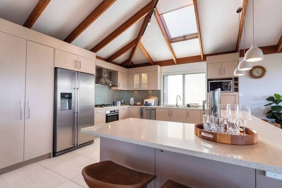 Unleash your culinary creativity in the fully equipped kitchen, featuring a double-door fridge-freezer, Bosch oven, Bosch induction cooktop, Nespresso coffee machine, microwave and dishwasher.