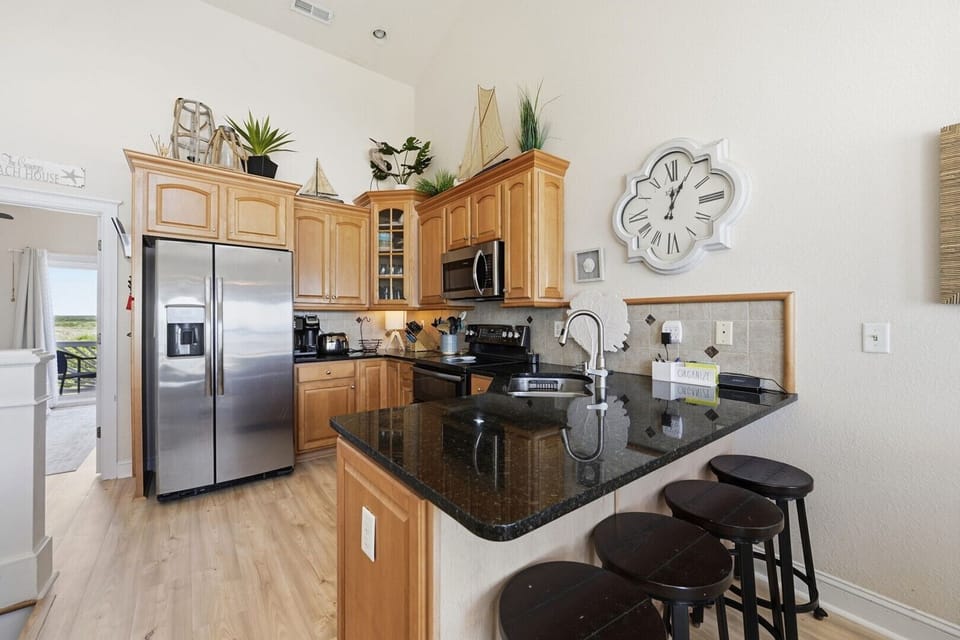 Expansive Kitchen and Additional Bar Seating