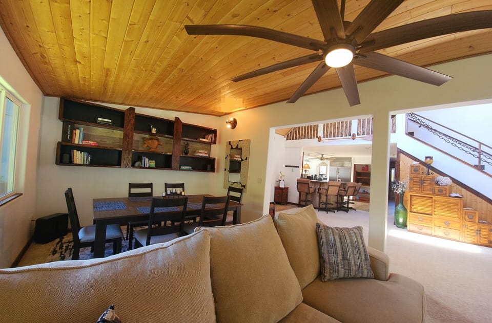 View from living room, looking towards formal dining area and into foyer and kitchen 
