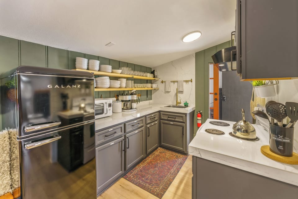 A stocked kitchen with a retro Galanz refrigerator is awaiting your visit!