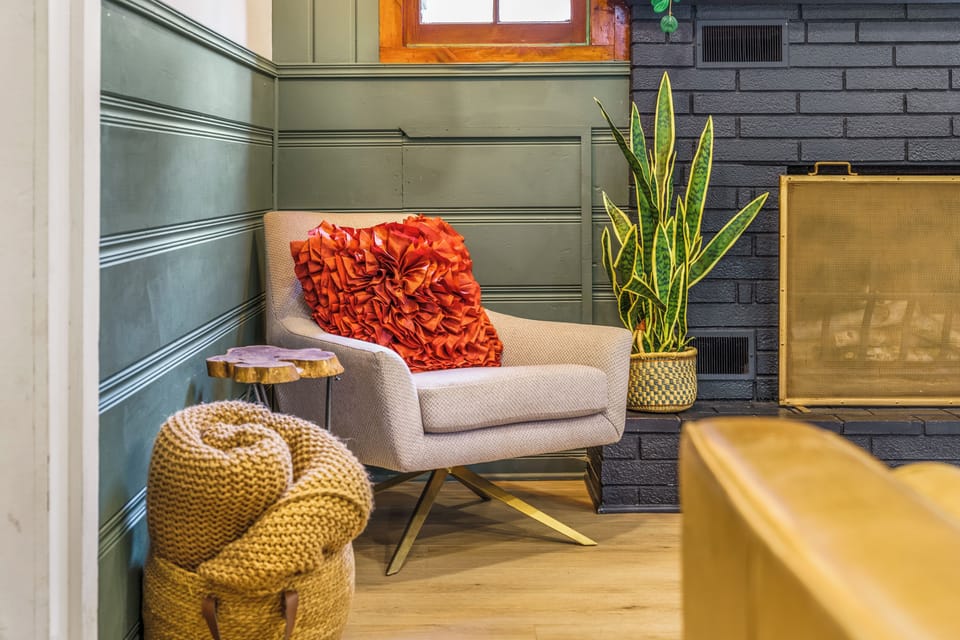 Cozy up by the fireplace ins a well designed western themed cabin