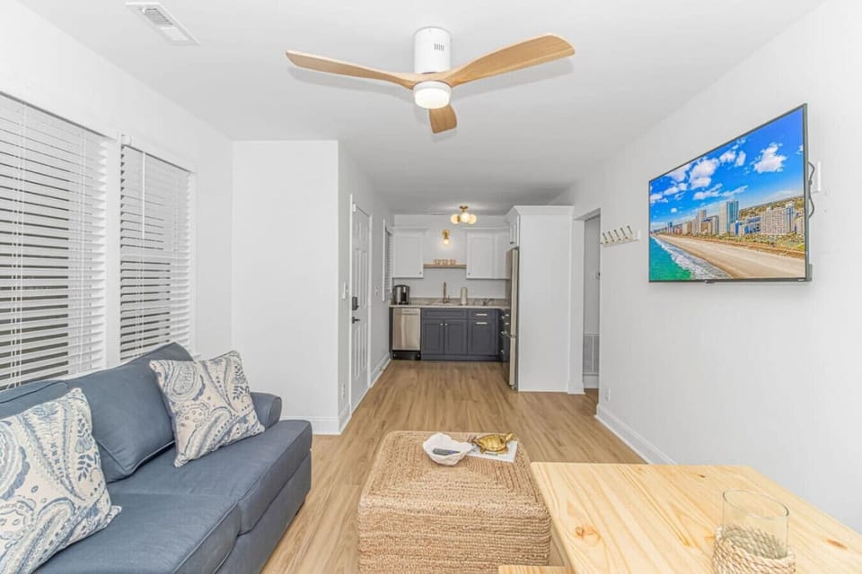 Bright open layout connecting living area and fully equipped kitchen