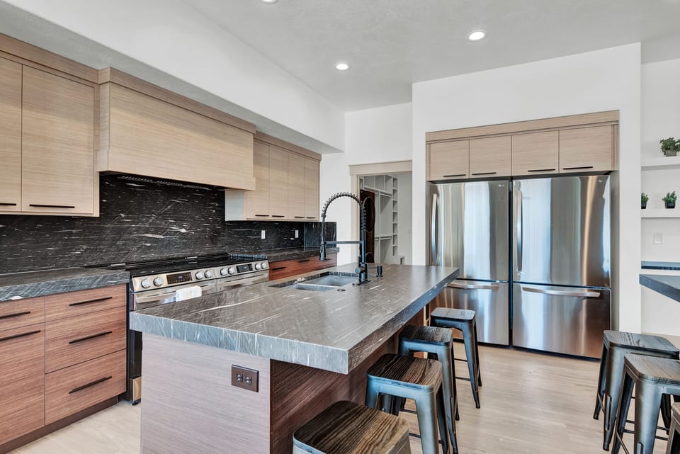 Kitchen with cooking island and iland for eating with 8 stools
