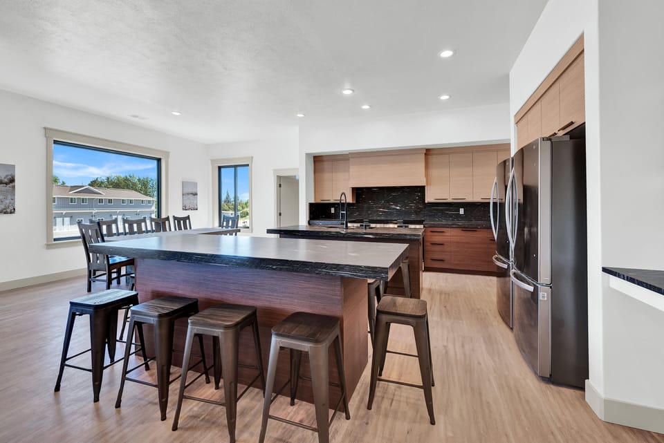 Kitchen with 2 islands & seating. 2 refrigerators, 2 dishwashers for large group