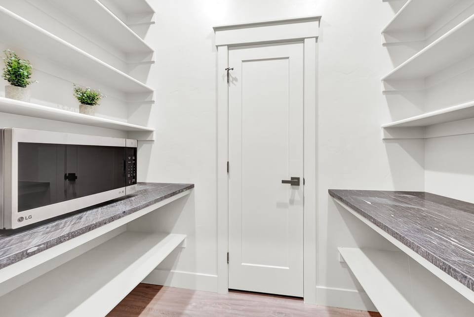 Storage and butlers pantry off kitchen.