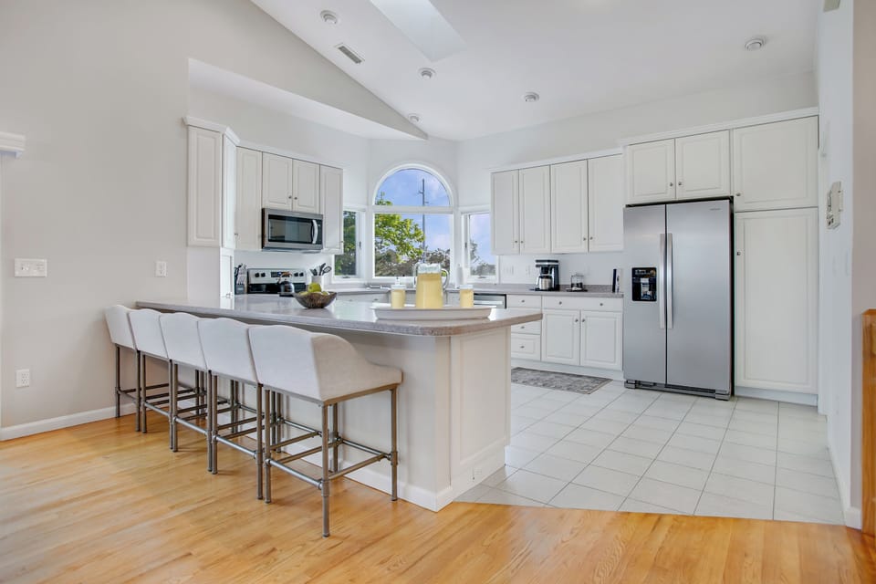 This kitchen peninsula is perfect for extra seating or for the kiddos to pull up a seat for late night ice cream Sundays :)