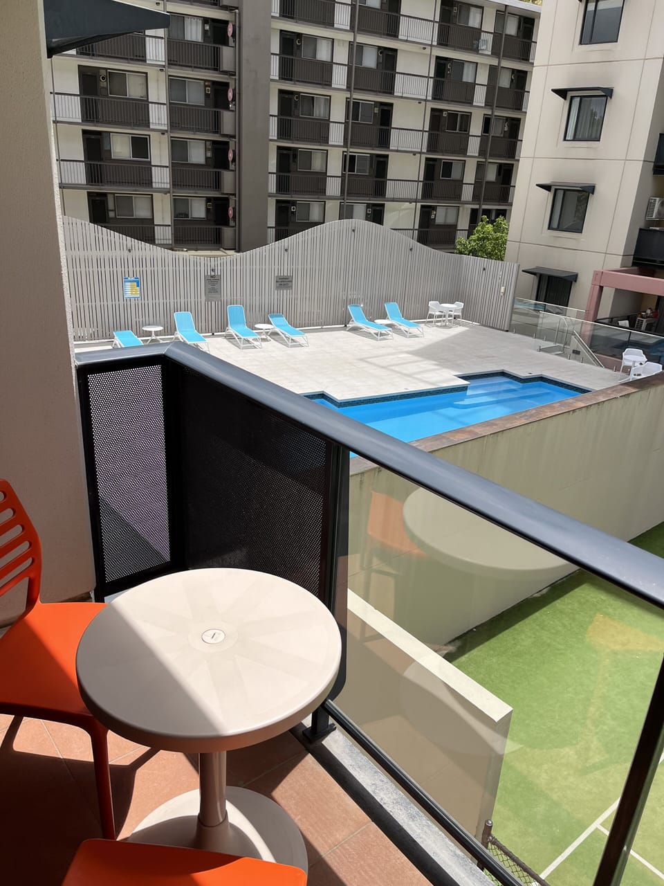 Relax on the balcony overlooking the resort pool