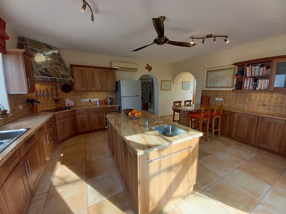 Kitchen view showing American-style fridge-freezer and island with second sink 