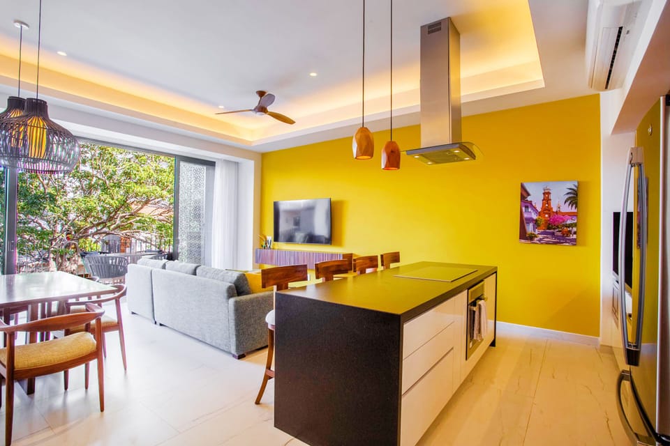 The gourmet kitchen is equipped with a full-size fridge, stove, oven and dishwasher