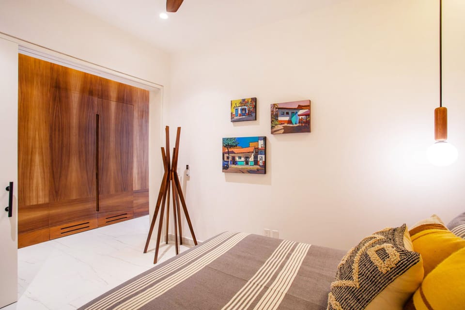 The guest bedroom has easy access to the second bathroom