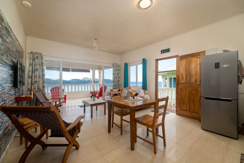 Standard Apartment, Bay View | Living area | 32-inch flat-screen TV with cable channels, TV