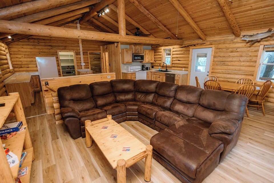 Spacious living area with coffee table, games, and Smart TV.