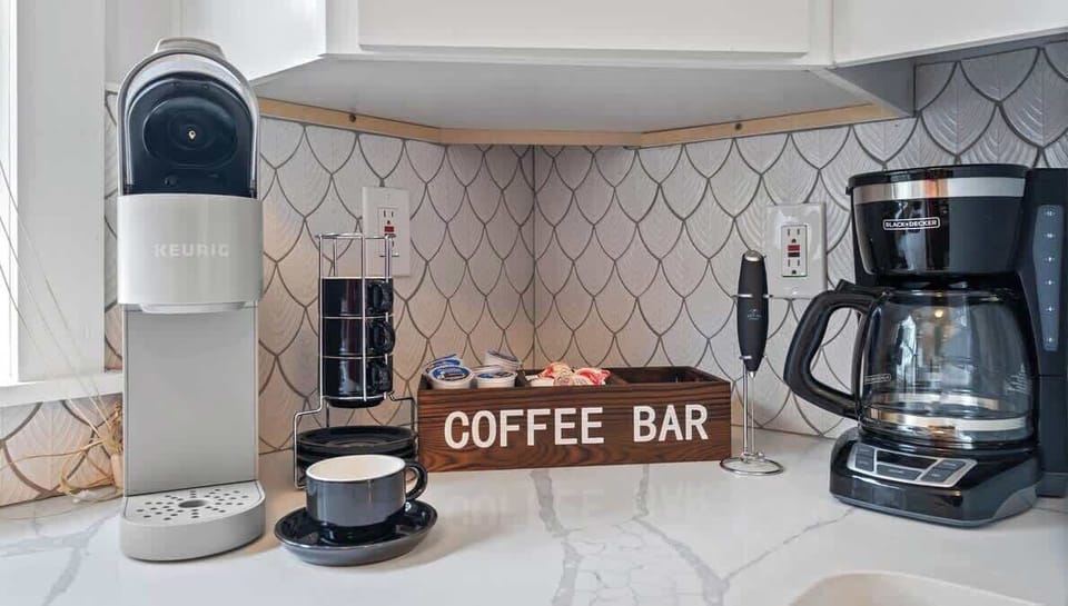 Fully stocked coffee bar with Keurig, Black Coffee Maker, Tea Kettle, Electric Frother, Espresso Cups, Coffee Pods, Creamer and Sugar!