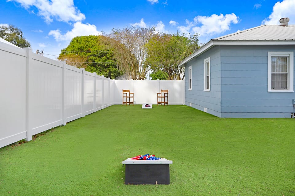 High top chairs for relaxing and cornhole set up for your use.
