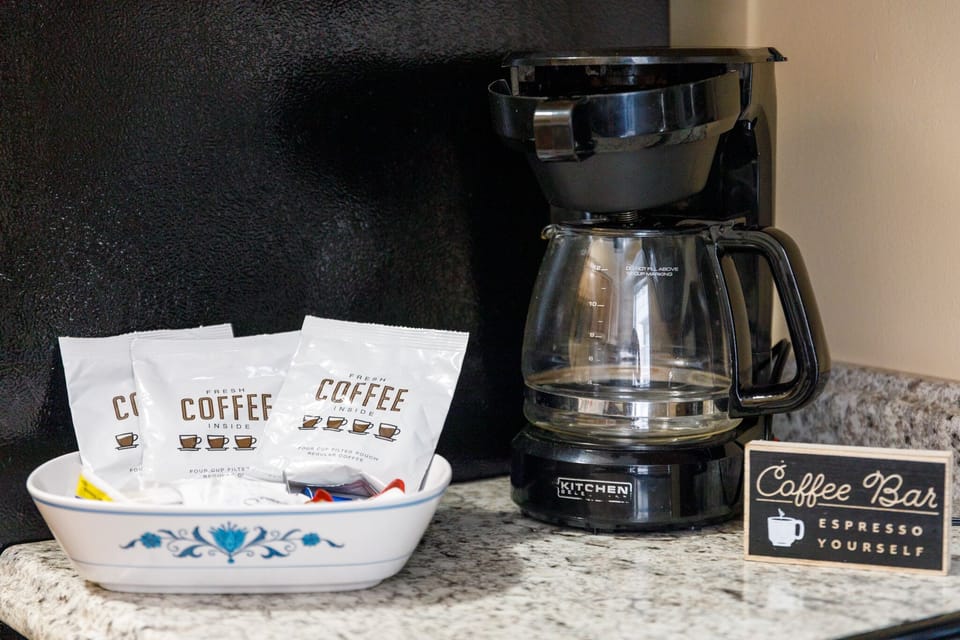 Start your mornings right w/ a drip coffee maker & everything set for a fresh brew.