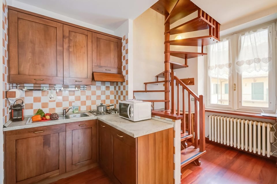Family Apartment, 2 Bedrooms, Balcony (La Torre In The Center Of Town) | Private kitchen | Electric kettle, dining tables
