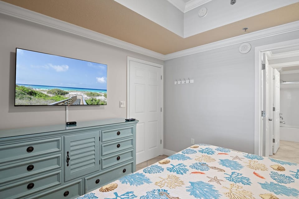 Bedroom has smart TV with cable service