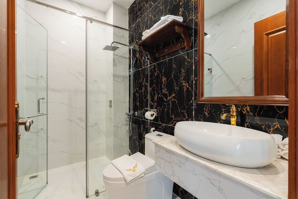 Shower, hydromassage showerhead, designer toiletries, hair dryer