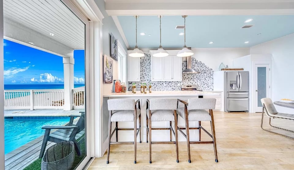 Cook breakfast while gazing at turquoise waters from your dream kitchen, complete with ocean views and modern amenities.