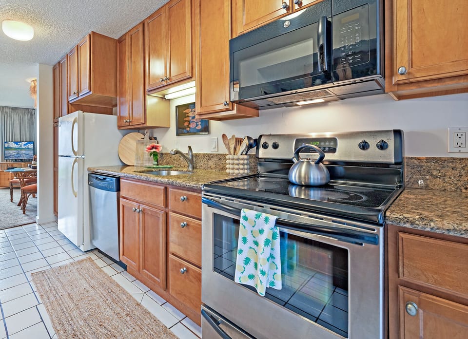 Full kitchen with stainless steel appliances - Fully Equipped Kitchen with stove, oven, microwave, dishwasher, and refrigerator.