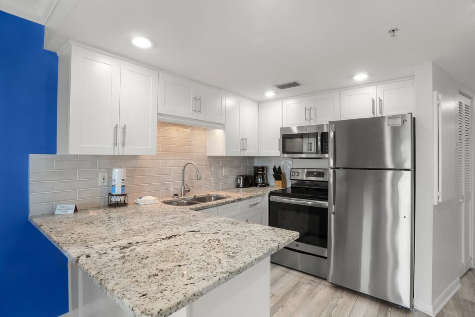 Full Kitchen with Stainless Steel Appliances.