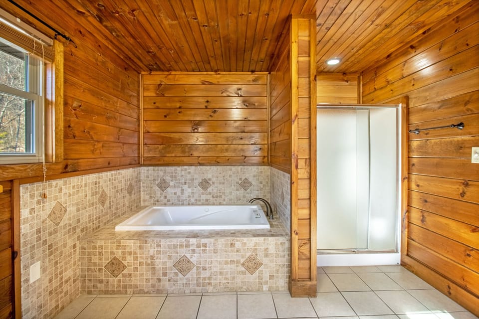 Private full bathroom includes double vanity, jetted tub, and stand up shower
