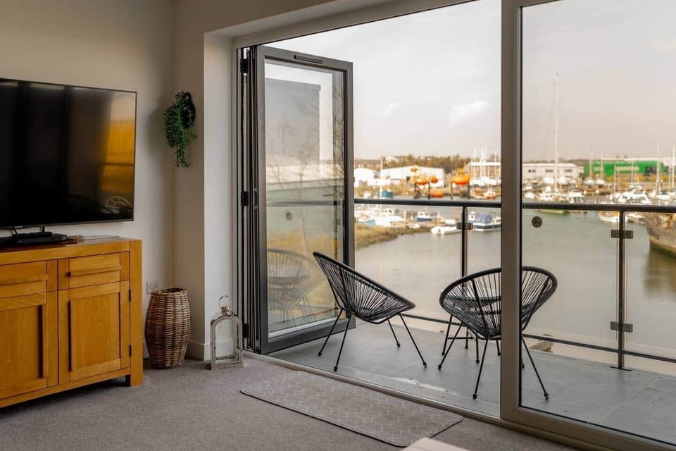 Bi-fold doors in the lounge to soak in being by the river.