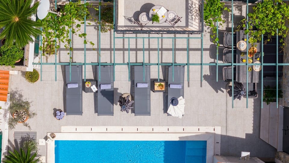 Sun deck area with deck chairs and parasol
