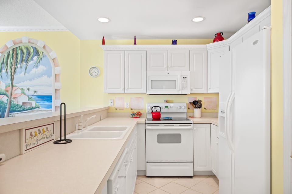 The Chef in the Family will love the Bright and Fully Stocked Kitchen!