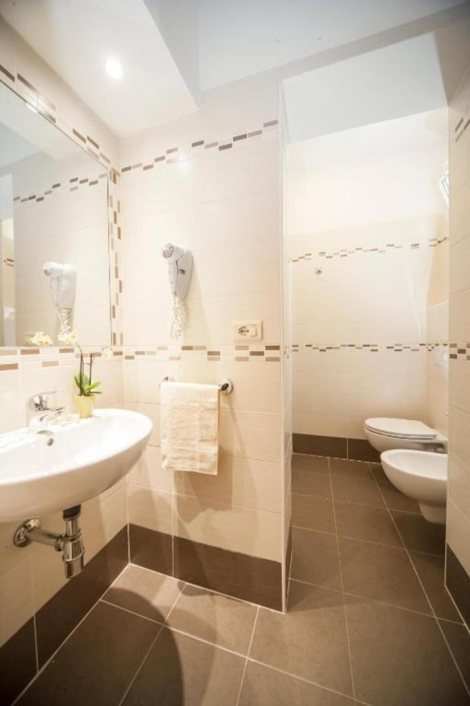 Shower, rainfall showerhead, hair dryer, towels