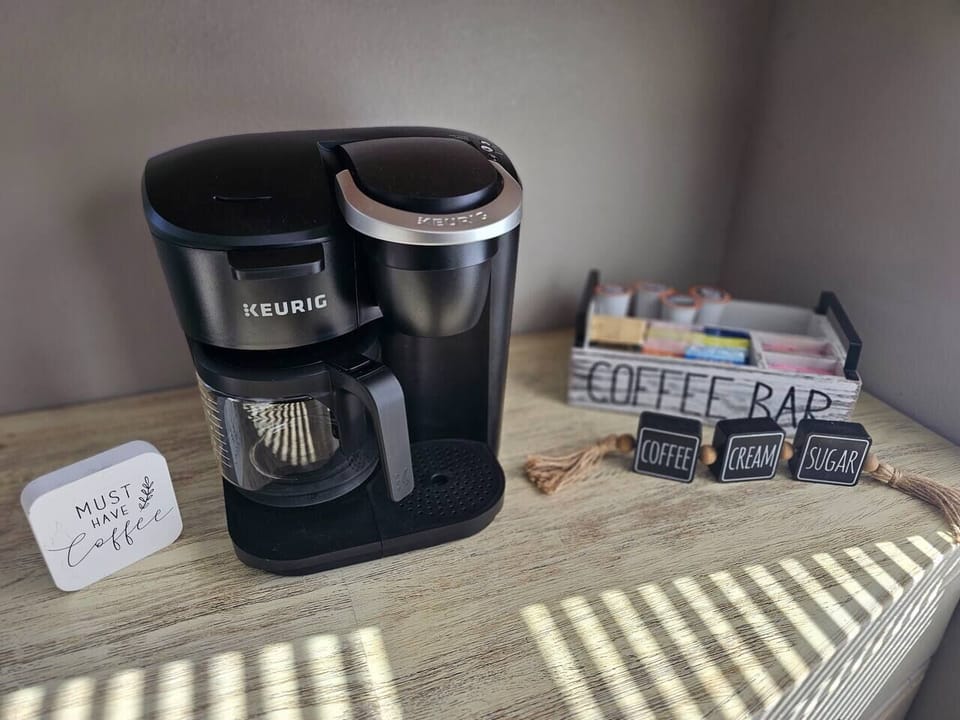 Few K-cup coffee, variety of hot tea bags, and sweet-n-low provided.there are some coffee filters in the cabinet for a full pot of coffee