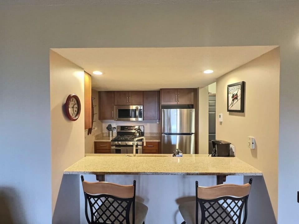 Gather around the countertop for snacks and laughter with family and friends.