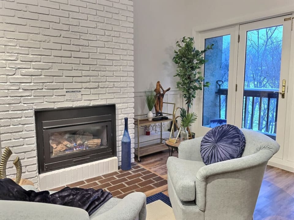 Inviting warmth emanates from the gas fireplace.