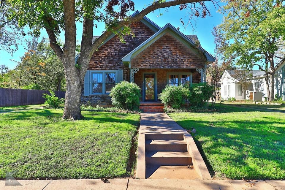 This 1938 shingle- style exterior is sure to catch your eye!
