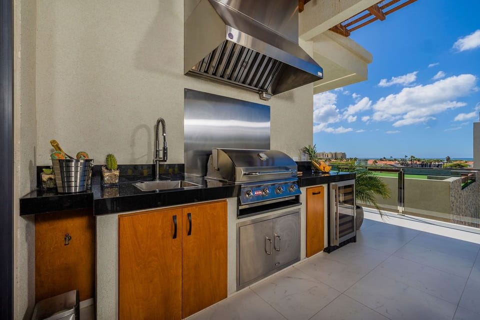 Upgrade your cooking game with this beautifully designed kitchen featuring a state-of-the-art stove top oven and a convenient sink.