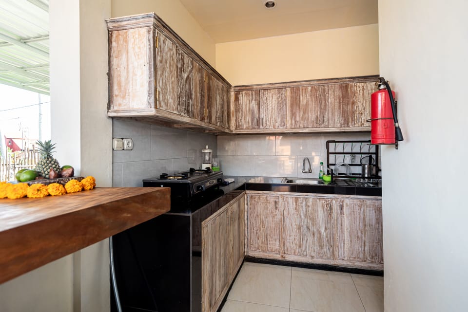 Deluxe Villa | Private kitchen | Fridge, stovetop, electric kettle, toaster