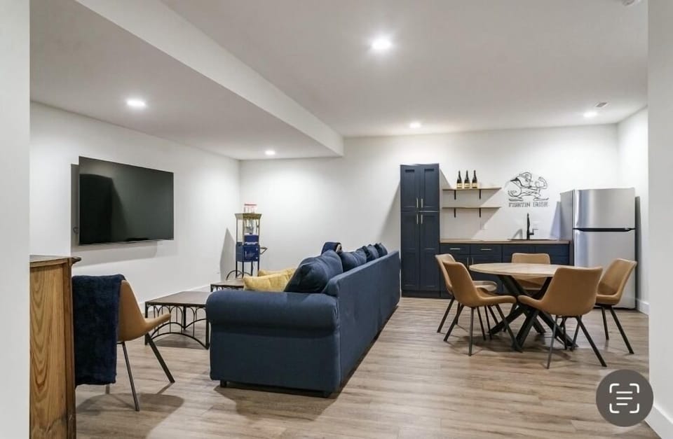 Furnished basement with wet bar, games and popcorn maker