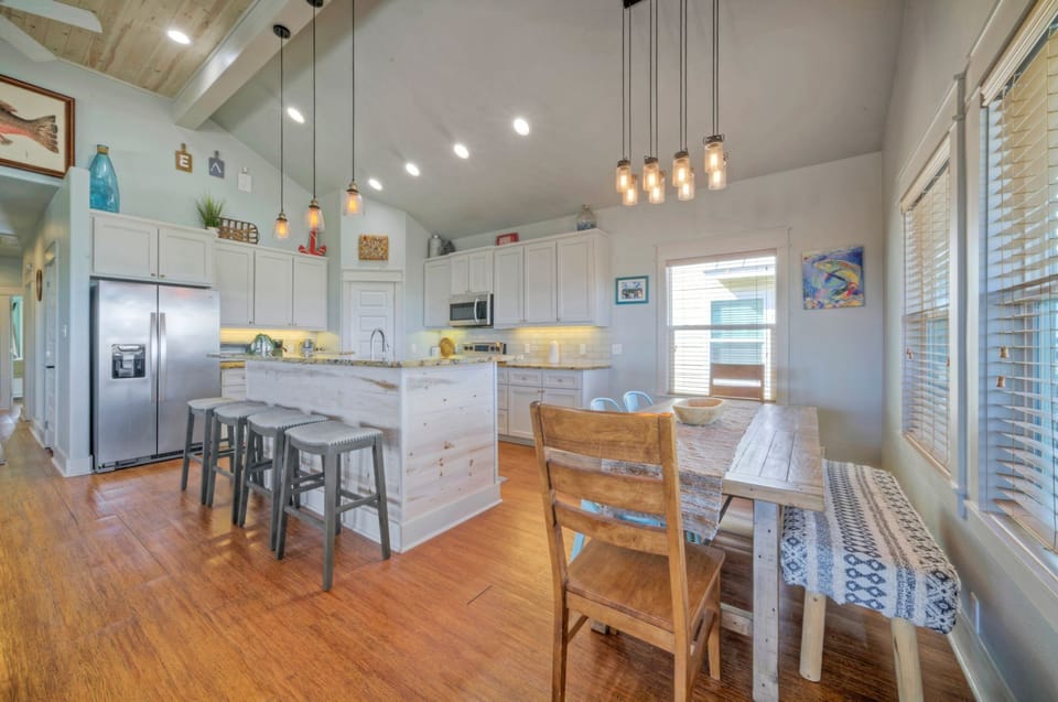 Stunning kitchen features an island.