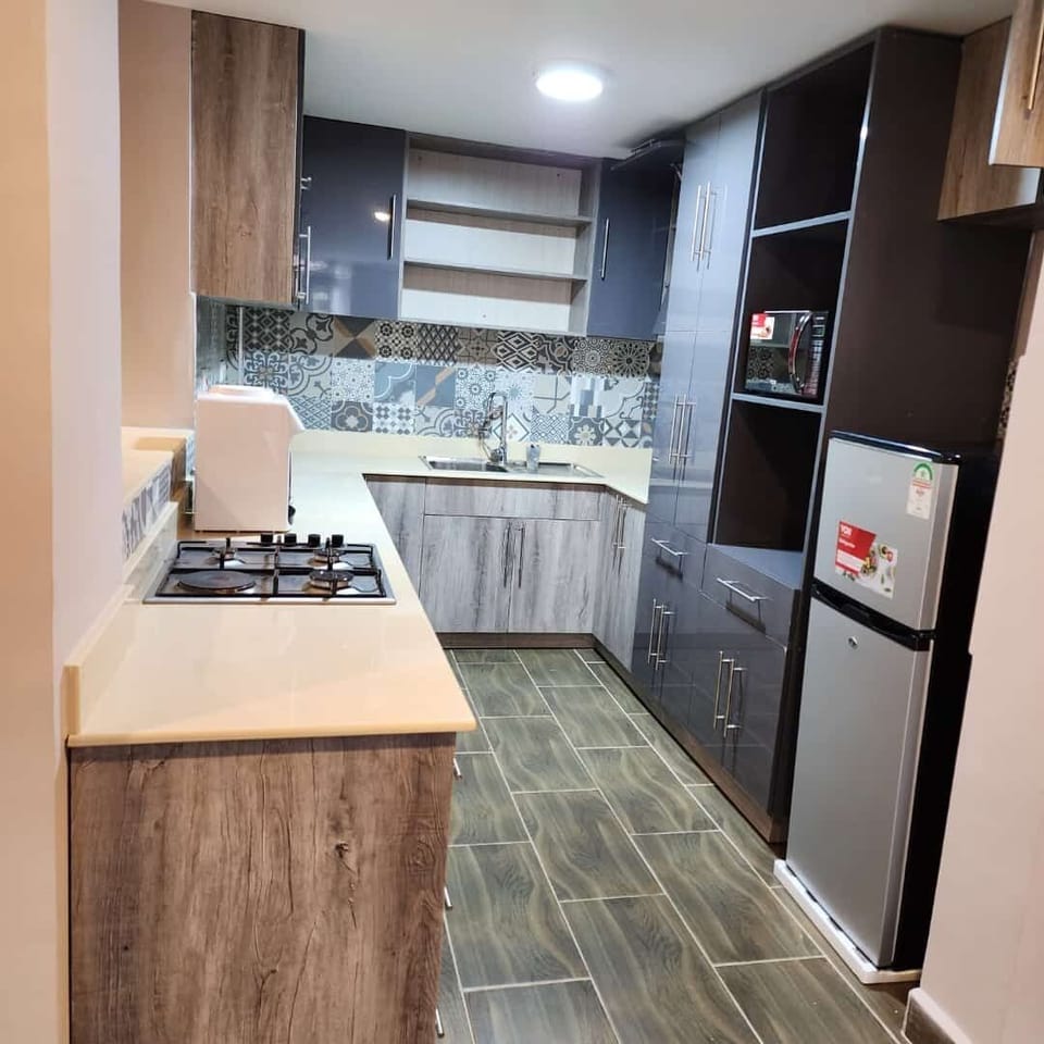 Family Apartment | Private kitchen | Fridge, microwave, cookware/dishes/utensils