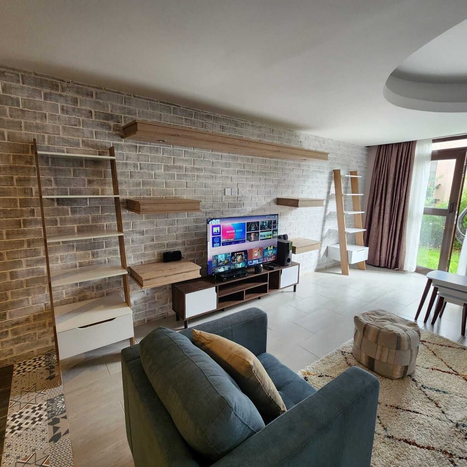Family Apartment | Living area | 24-inch Smart TV with satellite channels
