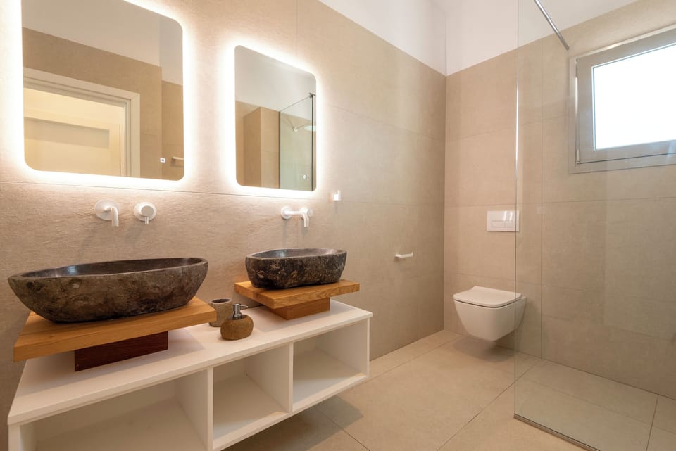 Two washbasins of rugged elegance stand as natural wonders.