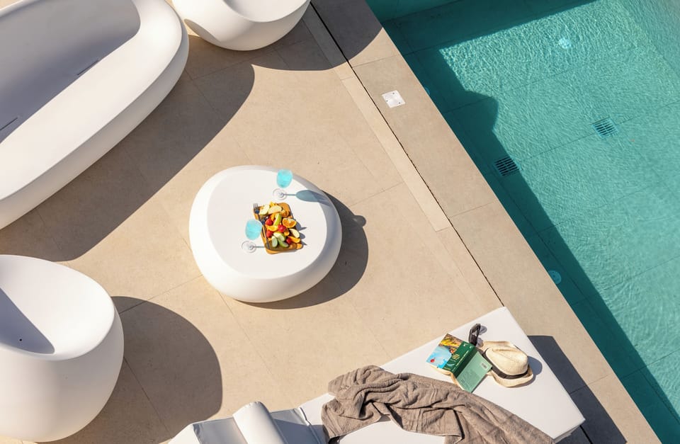 Sip drinks, soak up sun, and enjoy Telendos views.