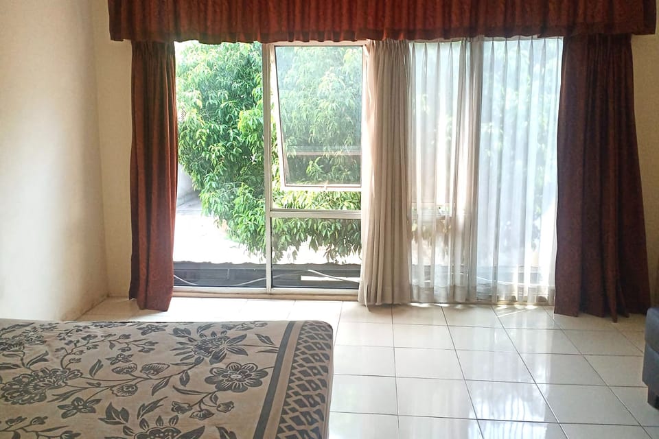 Family Room | Desk, blackout drapes, iron/ironing board, rollaway beds