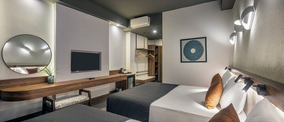 Deluxe Triple Room with Pool View | Minibar, desk, soundproofing, free WiFi