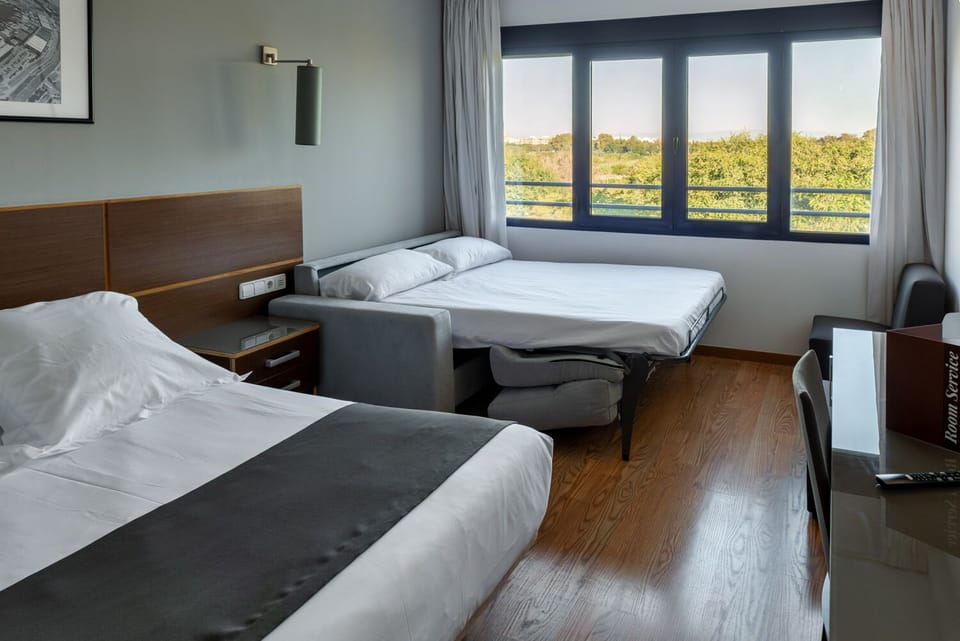 Quadruple Room | Premium bedding, down comforters, soundproofing, iron/ironing board